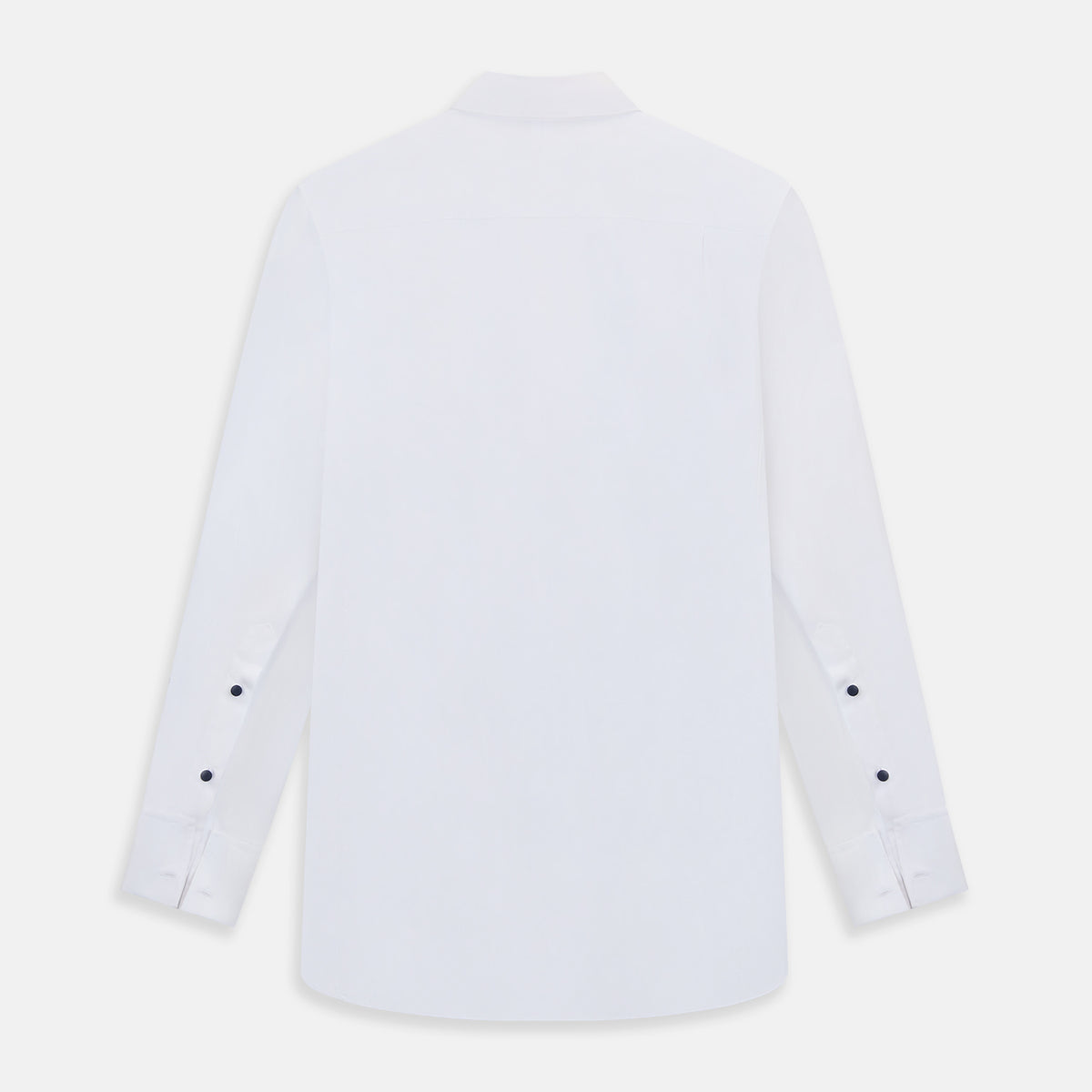 View 3 of product The Casino Royale White Dress Shirt in Cotton by Turnbull & Asser UK is a long-sleeve white dress shirt, crafted from crisp white cotton poplin with a pleated bib front, black buttons, and a classic collar, shown laid flat on a white background.