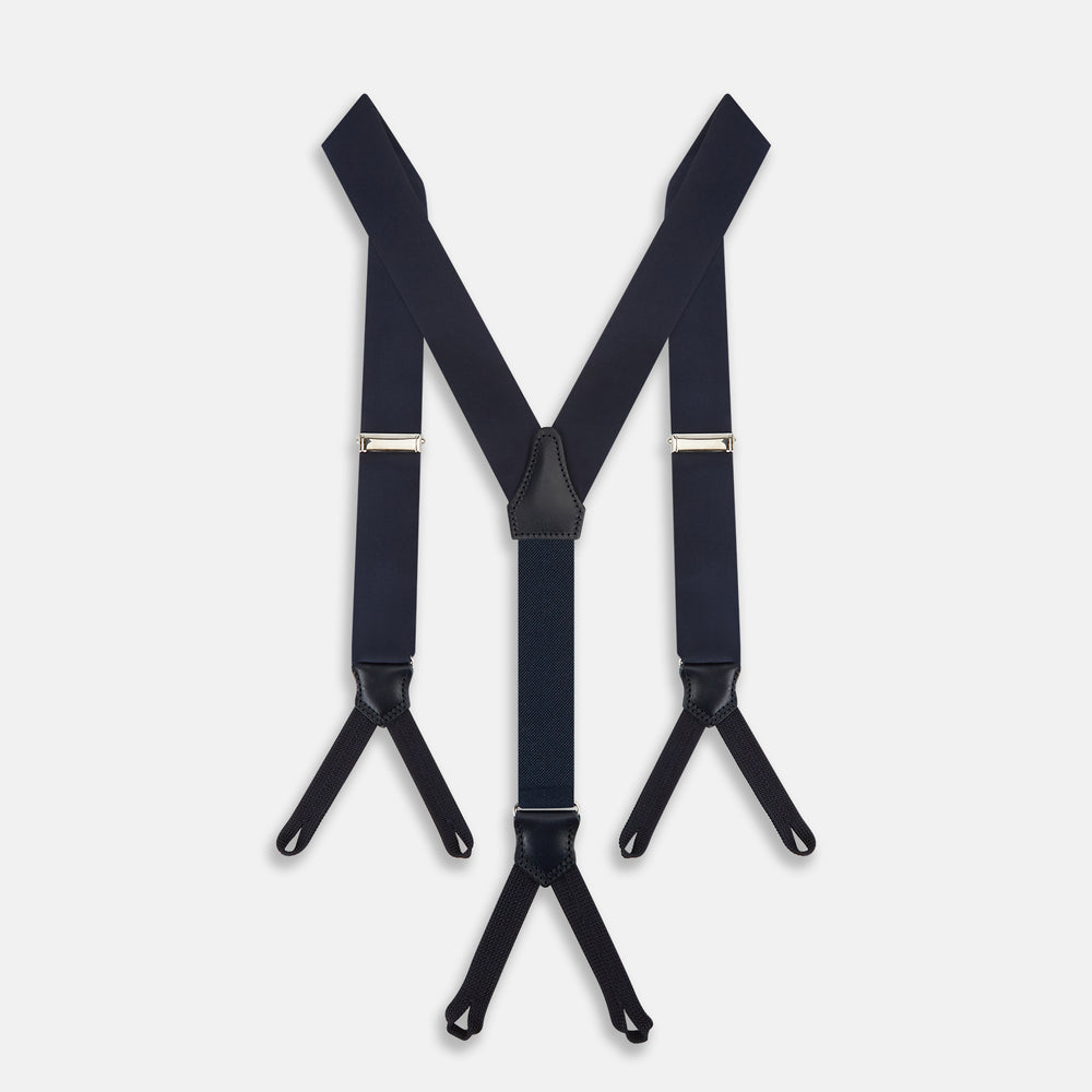 The Turnbull & Asser UK Casino Royale Midnight Blue Braces in Silk, featuring leather and elastic looped ends inspired by the iconic Casino Royale style, are displayed vertically against a white background—a sophisticated accessory for formal eveningwear.