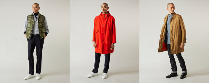 A man models three different outfits: a green vest over a dress shirt and tie, a bright red raincoat, and a tan coat over a blue shirt, all paired with dark pants and white sneakers.