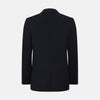 View 3 of product The Navy Knitted London Blazer by Turnbull & Asser features notch lapels, two buttons, and three front pockets—ideal for spring or summer contemporary looks. Displayed on a plain white background.