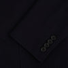 View 4 of product The Navy Knitted London Blazer by Turnbull & Asser features notch lapels, two buttons, and three front pockets—ideal for spring or summer contemporary looks. Displayed on a plain white background.