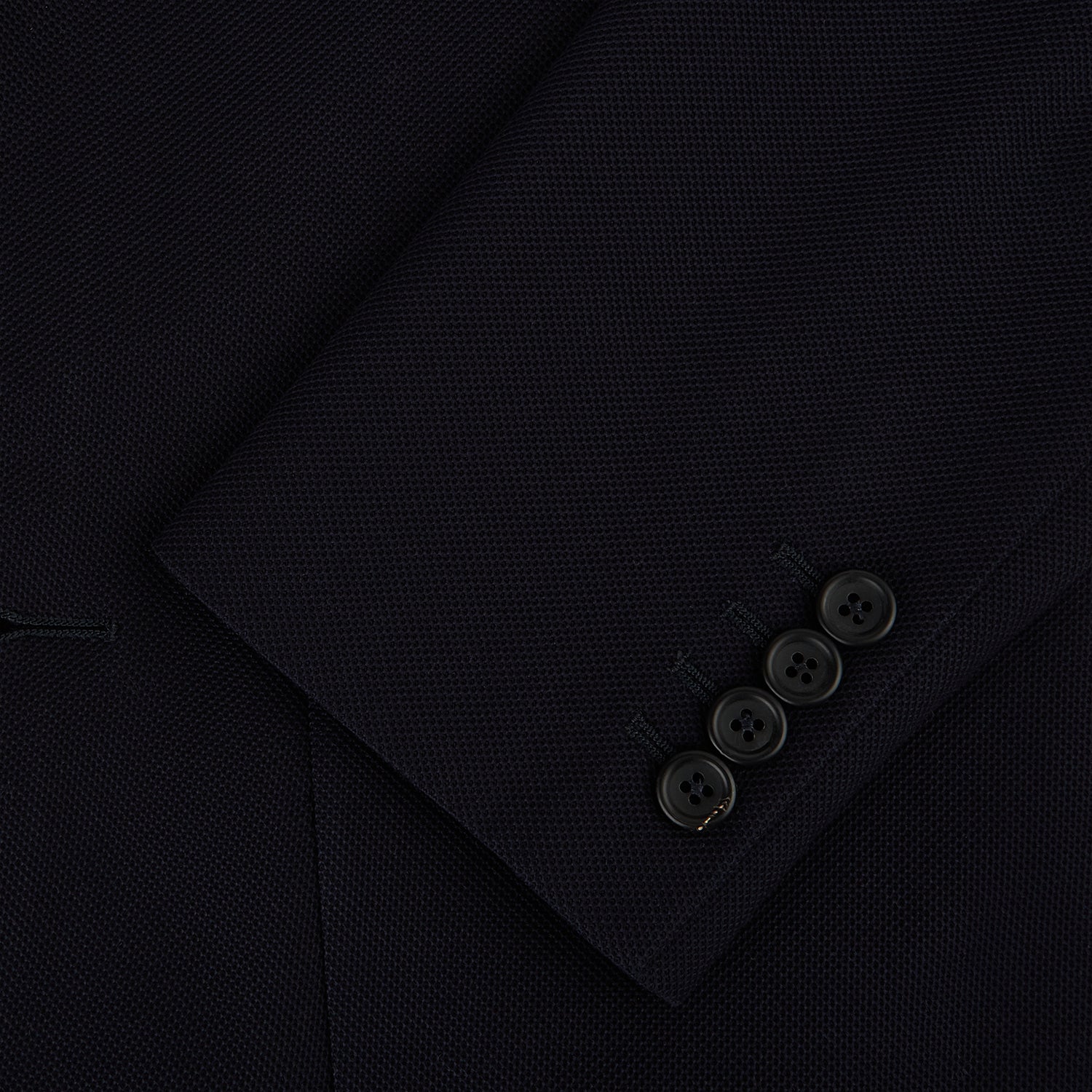 View 4 of product The Navy Knitted London Blazer by Turnbull & Asser features notch lapels, two buttons, and three front pockets—ideal for spring or summer contemporary looks. Displayed on a plain white background.