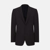 View 1 of product The Turnbull & Asser Dark Chocolate Knitted London Blazer features a notched lapel, two buttons, and two front pockets for versatile everyday wear. Shown against a plain white background.