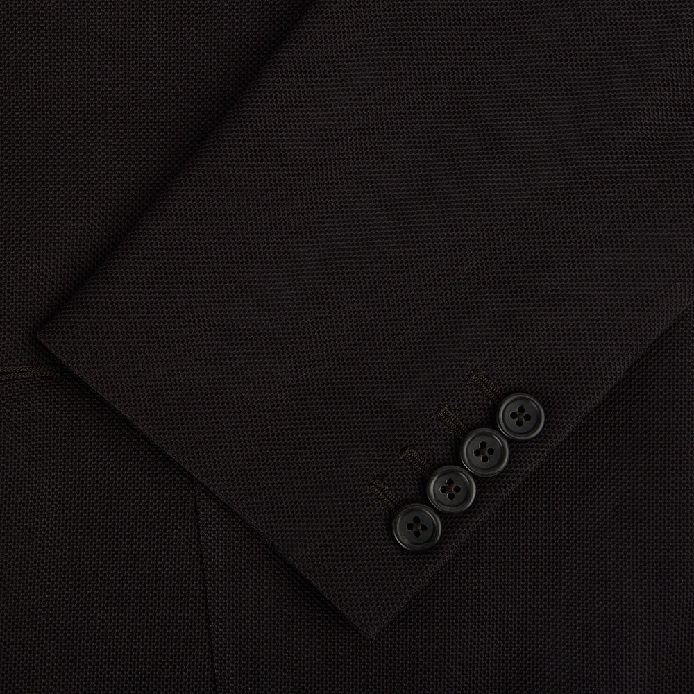 The Turnbull & Asser Dark Chocolate Knitted London Blazer features a notched lapel, two buttons, and two front pockets for versatile everyday wear. Shown against a plain white background.