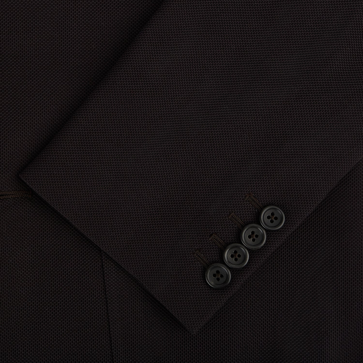 View 4 of product The Turnbull & Asser Dark Chocolate Knitted London Blazer features a notched lapel, two buttons, and two front pockets for versatile everyday wear. Shown against a plain white background.