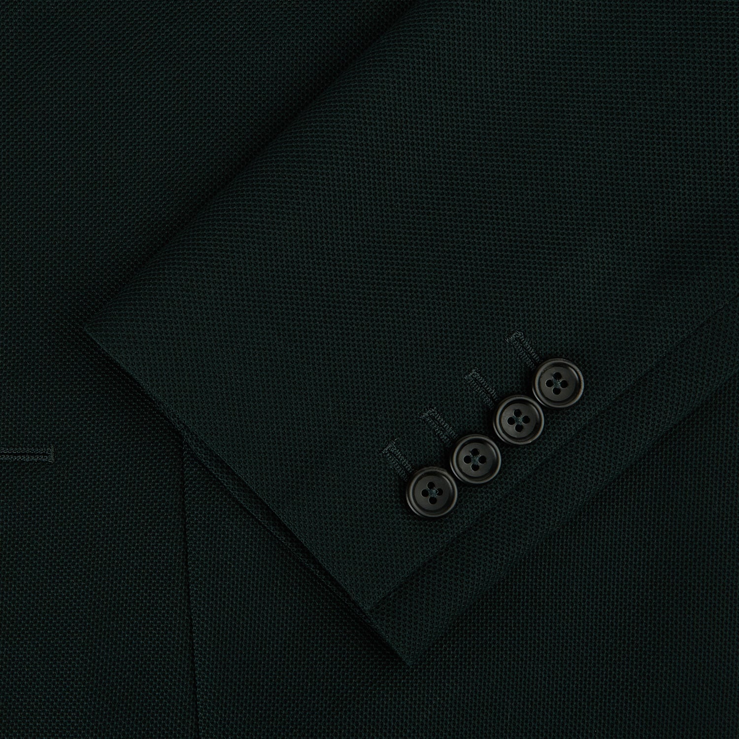 View 4 of product The Turnbull & Asser Forest Green Knitted London Blazer showcases notch lapels, two buttons, patch and chest pockets on a white background—a modern classic for timeless style.