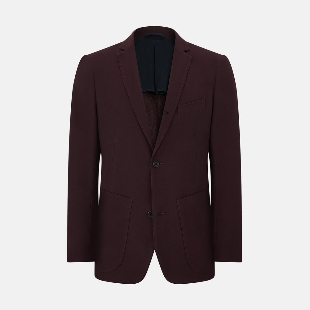 The Turnbull & Asser Burgundy Knitted London Blazer features notch lapels, two front buttons, flap pockets, and a welt chest pocket—ideal for spring and summer—shown against a plain white background.