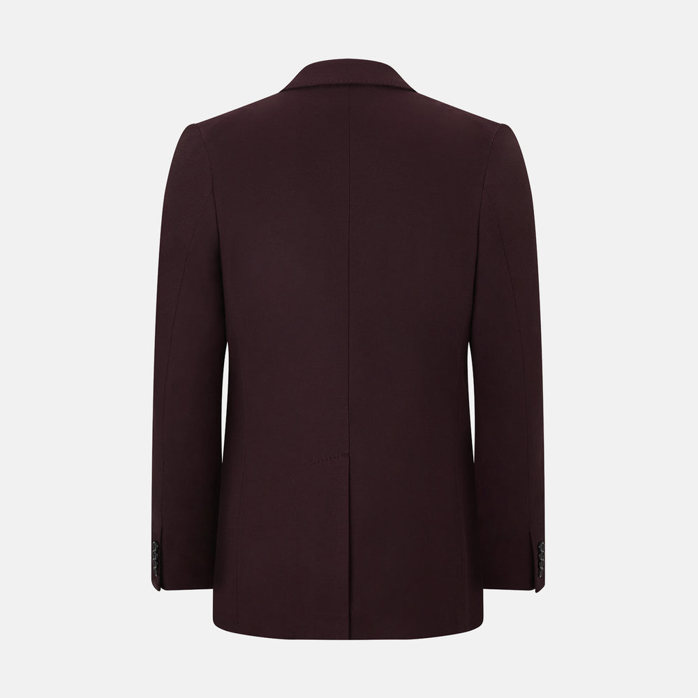 The Turnbull & Asser Burgundy Knitted London Blazer features notch lapels, two front buttons, flap pockets, and a welt chest pocket—ideal for spring and summer—shown against a plain white background.
