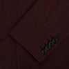 View 4 of product The Turnbull & Asser Burgundy Knitted London Blazer features notch lapels, two front buttons, flap pockets, and a welt chest pocket—ideal for spring and summer—shown against a plain white background.