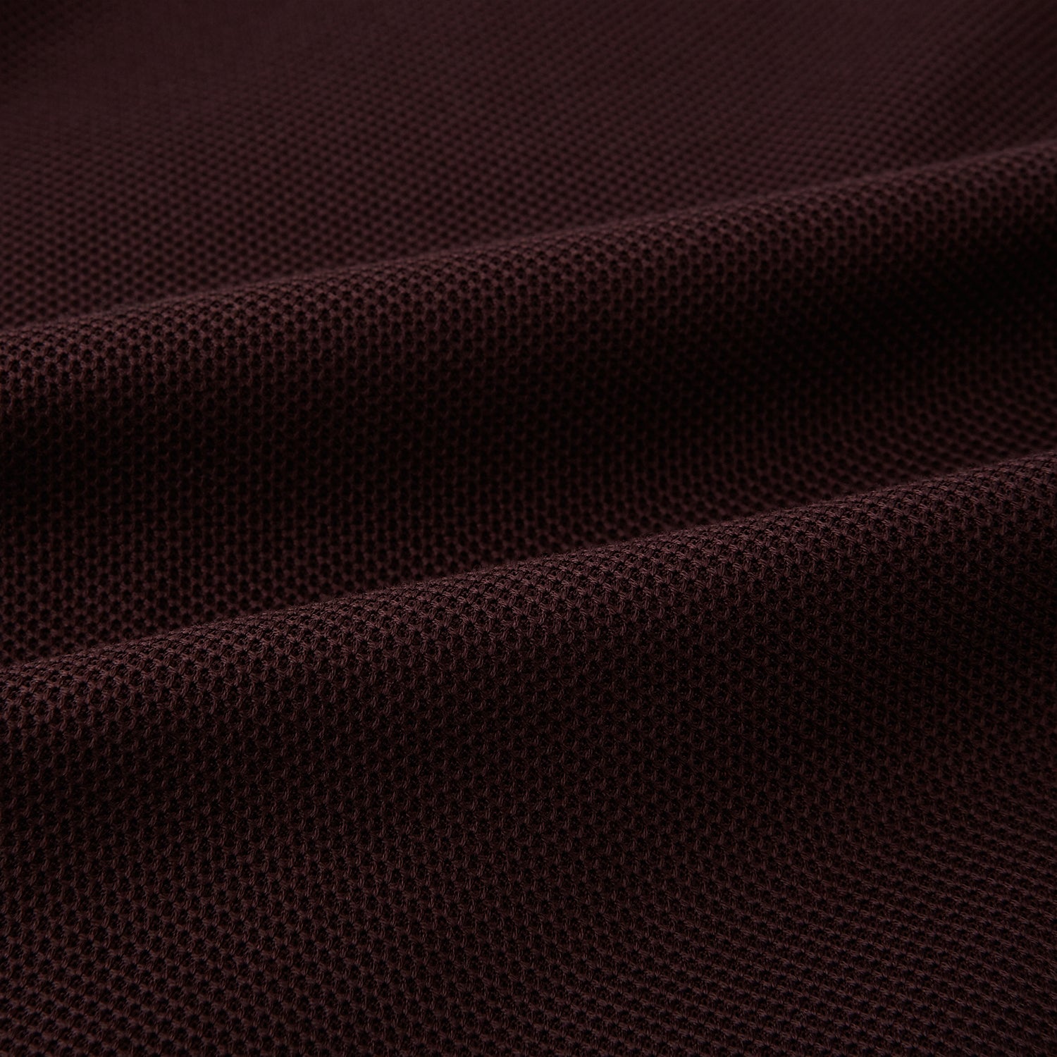 View 5 of product The Turnbull & Asser Burgundy Knitted London Blazer features notch lapels, two front buttons, flap pockets, and a welt chest pocket—ideal for spring and summer—shown against a plain white background.