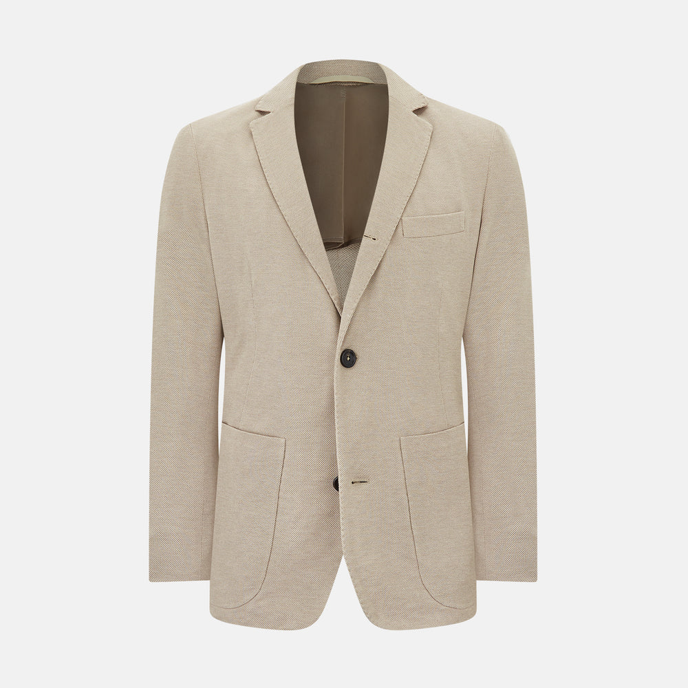 The Turnbull & Asser UK Sand Silk & Cotton Bath Blazer showcases Italian craftsmanship with notched lapels, two front buttons, large patch pockets, and a chest pocket, all set against a plain white background.