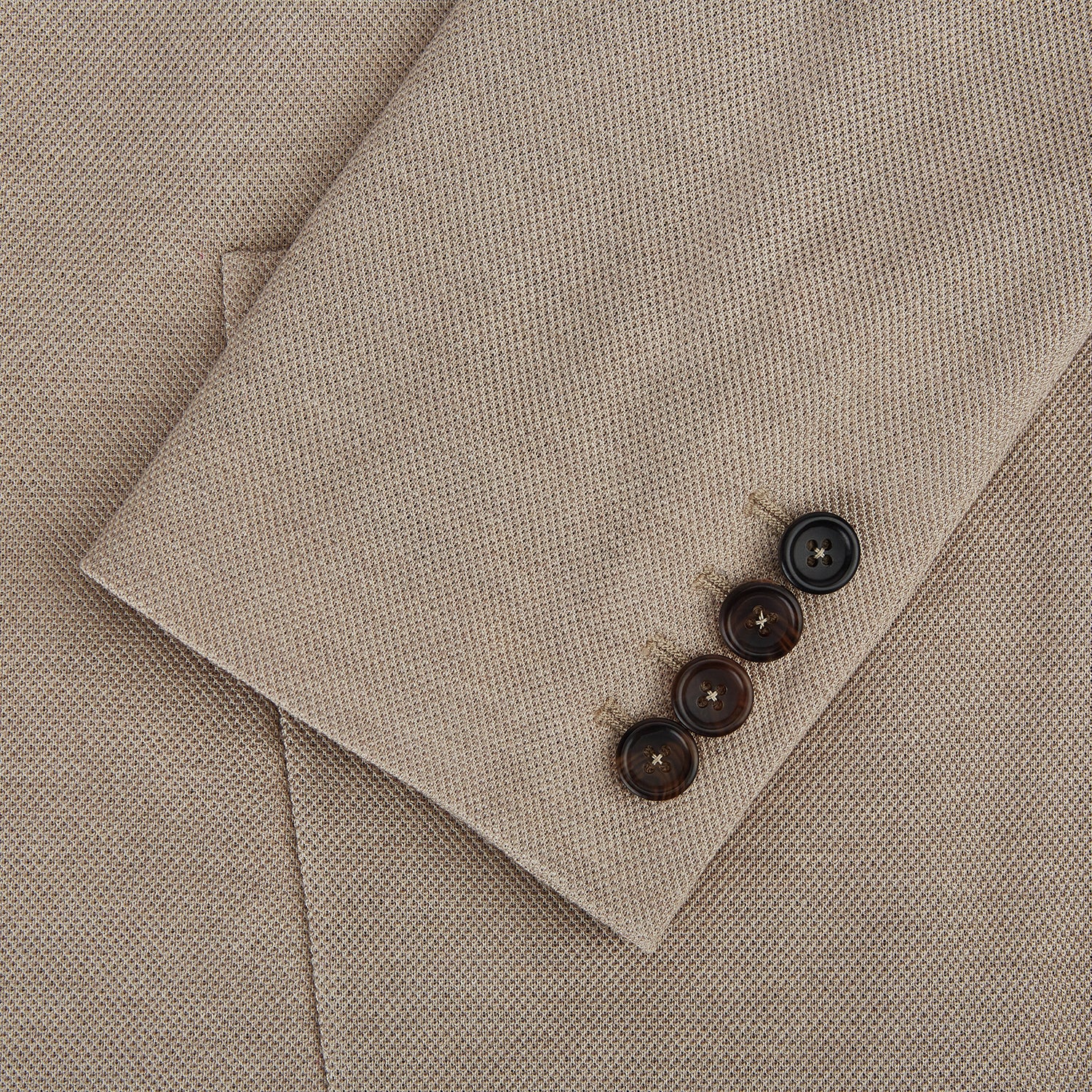 View 4 of product The Turnbull & Asser UK Sand Silk & Cotton Bath Blazer showcases Italian craftsmanship with notched lapels, two front buttons, large patch pockets, and a chest pocket, all set against a plain white background.