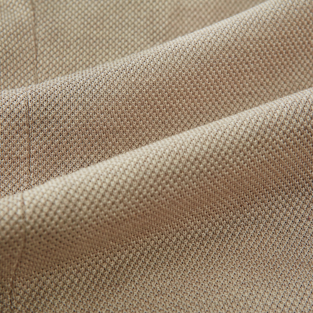 The Turnbull & Asser UK Sand Silk & Cotton Bath Blazer showcases Italian craftsmanship with notched lapels, two front buttons, large patch pockets, and a chest pocket, all set against a plain white background.