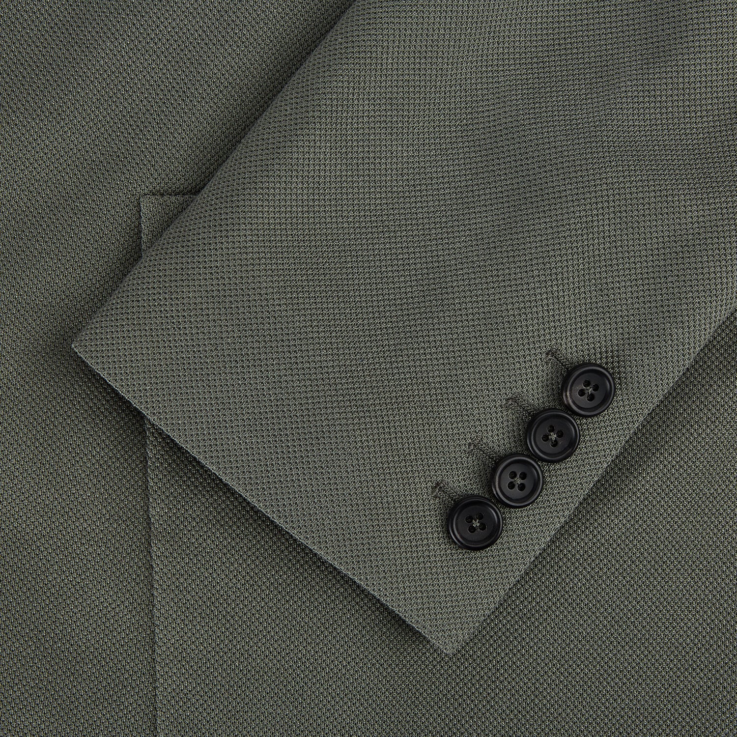 View 4 of product The Turnbull & Asser UK Sage Silk & Cotton Bath Blazer is a single-breasted Italian-tailored piece in olive green, featuring notch lapels, two front patch pockets, a chest pocket, and two buttons, shown on a plain white background.