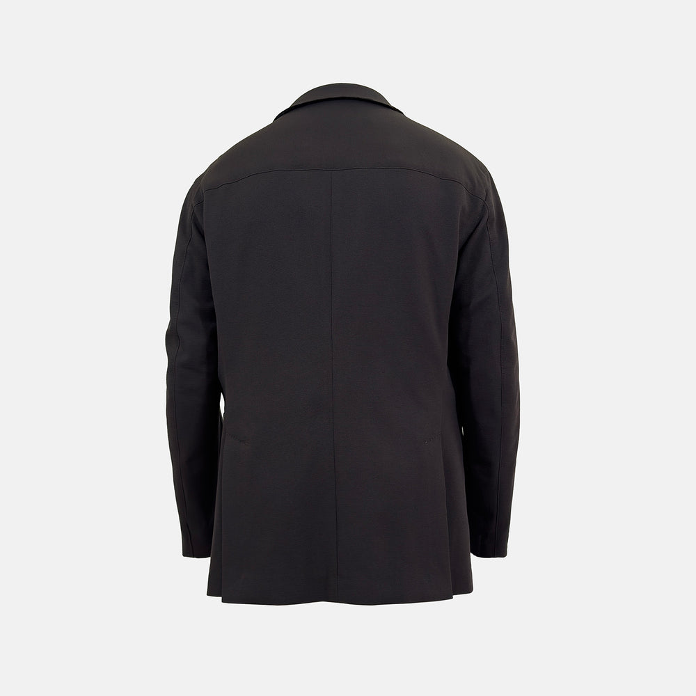 Introducing the Riviera Chocolate Oversized Blazer in Cotton by Turnbull & Asser UK—a dark brown blazer featuring two front buttons, three patch pockets, and notch lapels. Crafted from a cotton-nylon stretch fabric and showcased against a plain white background, this piece is a timeless addition to your autumn wardrobe.