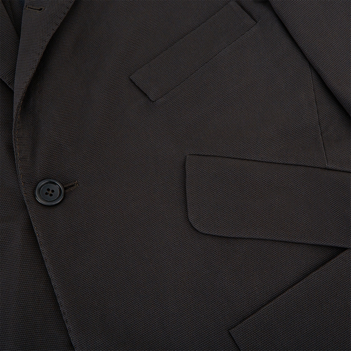 View 8 of product Introducing the Riviera Chocolate Oversized Blazer in Cotton by Turnbull & Asser UK—a dark brown blazer featuring two front buttons, three patch pockets, and notch lapels. Crafted from a cotton-nylon stretch fabric and showcased against a plain white background, this piece is a timeless addition to your autumn wardrobe.