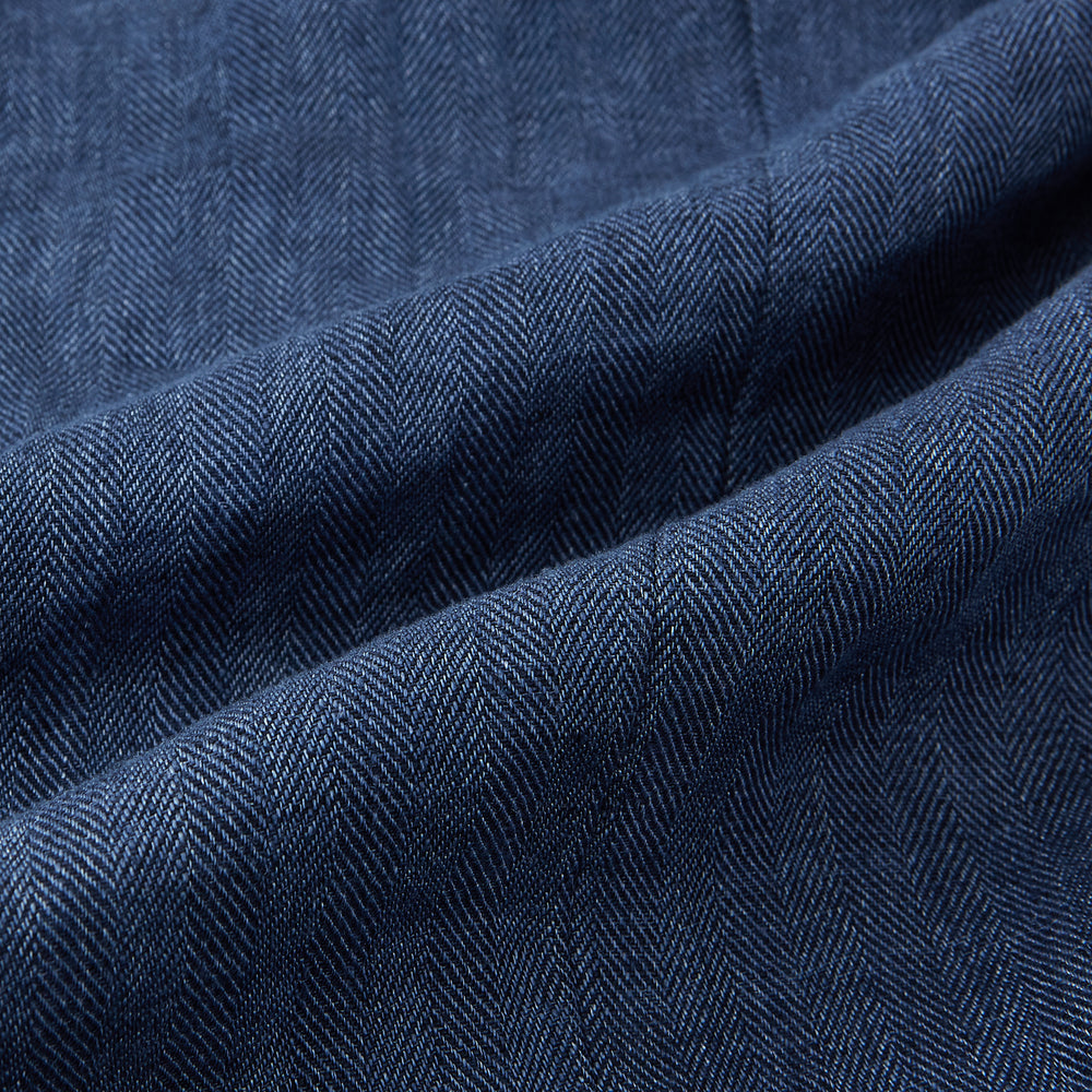 The Henley Denim Blazer in Linen by Turnbull & Asser UK features a double-breasted design with six black buttons, notch lapels, two front pockets, and a chest pocket—a timeless staple for effortless British summer dressing—displayed on a plain white background.
