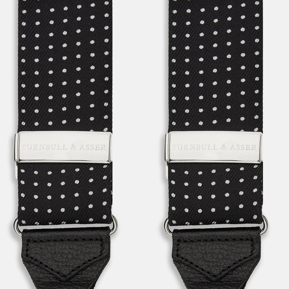 Turnbull & Asser Black & White Small Spot Adjustable Silk Braces with leather loops and silver adjusters, featuring small white polka dots—perfect for refined style and shown against a white background.