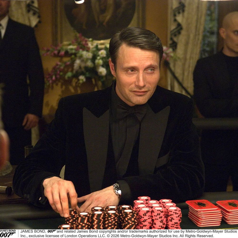 A pair of Turnbull & Asser Casino Royale Black Braces As Seen On Le Chiffre, featuring black moiré fabric, leather loops, and gold-tone adjusters, handmade in England and showcased against a white background.