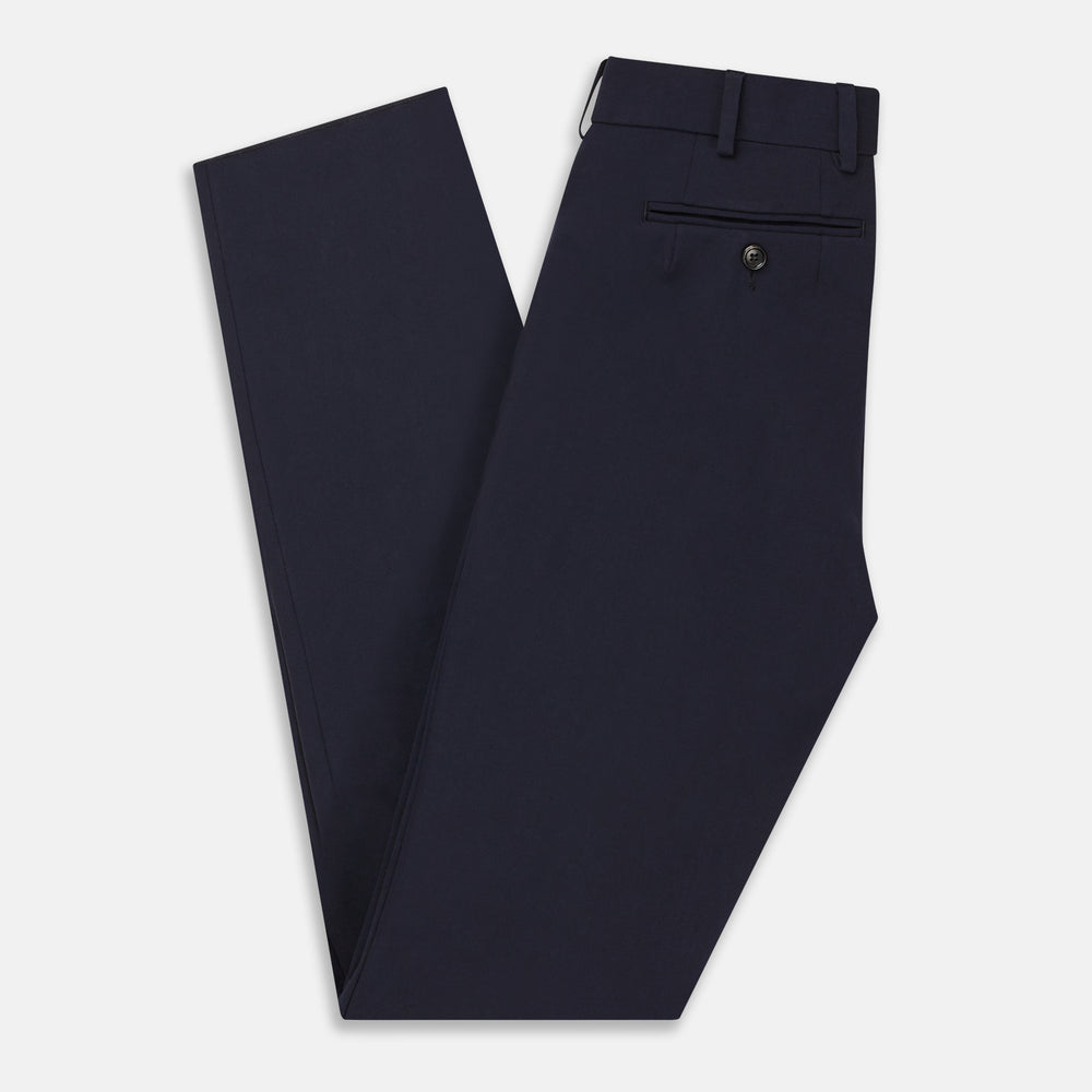 The Navy Blue James Trouser by Turnbull & Asser features a tailored straight-leg cut, flat front, belt loops, and button closure, shown on a plain white background for an elegant and versatile look.