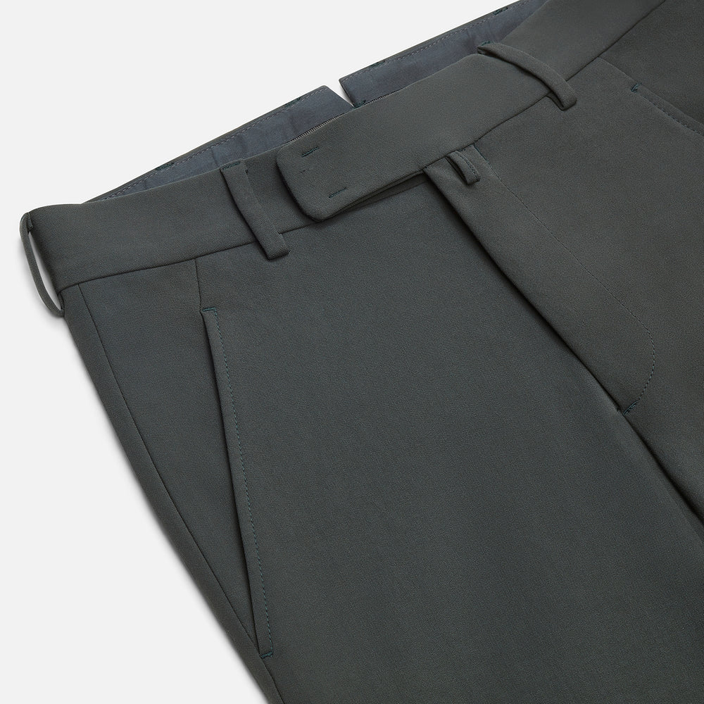 A pair of slim-fit Dark Green James trousers by Turnbull & Asser in Italian cotton, featuring belt loops, side pockets, and a flat front, shown against a plain white background.