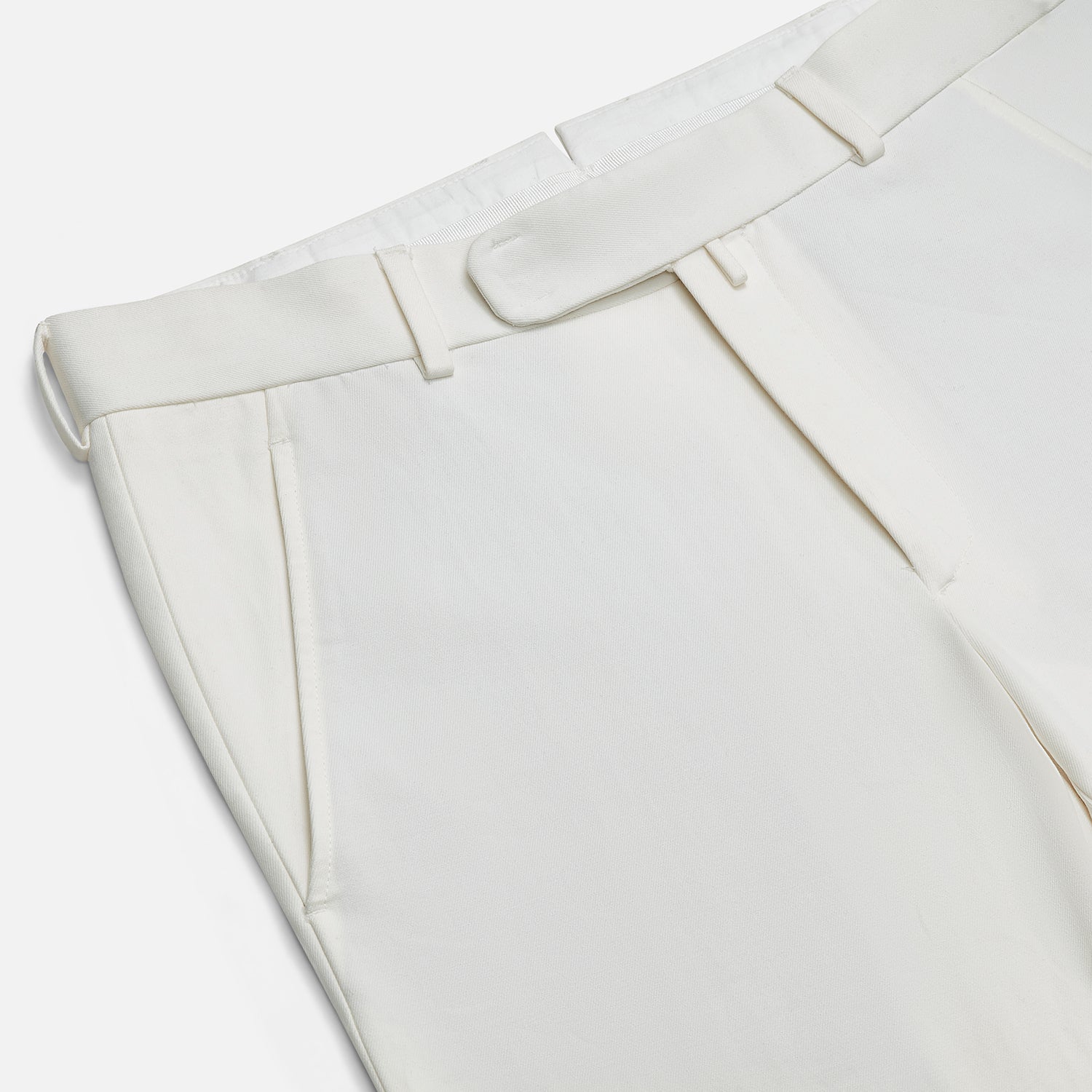 View 2 of product The Off White James Trouser by Turnbull & Asser is a straight fit pair with belt loops and side pockets, crafted from Italian cotton, shown against a plain light background.
