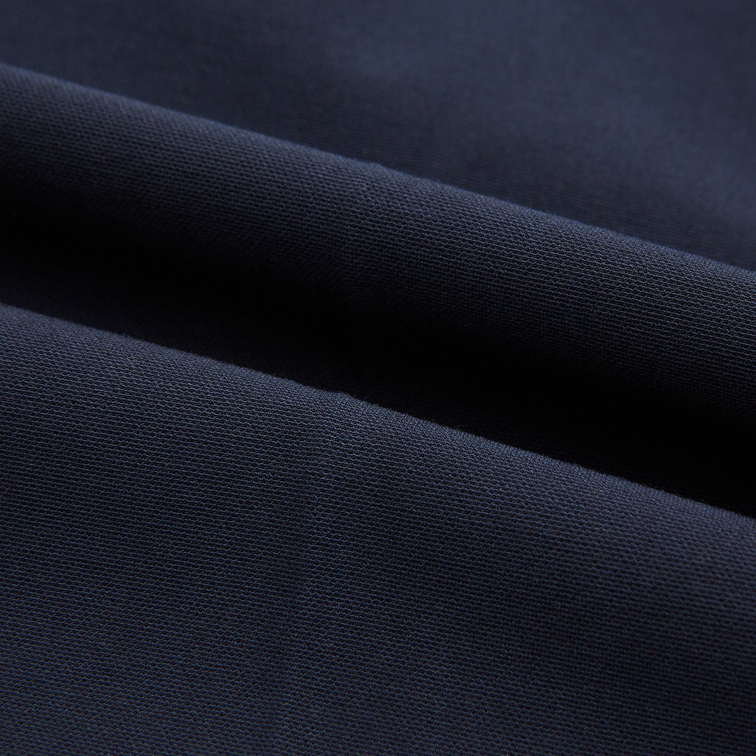 View 6 of product Turnbull & Asser Navy George Trousers in a cotton blend with a single pleat, button and zipper closure, belt loops, and crease detailing down each leg, shown on a plain white background.