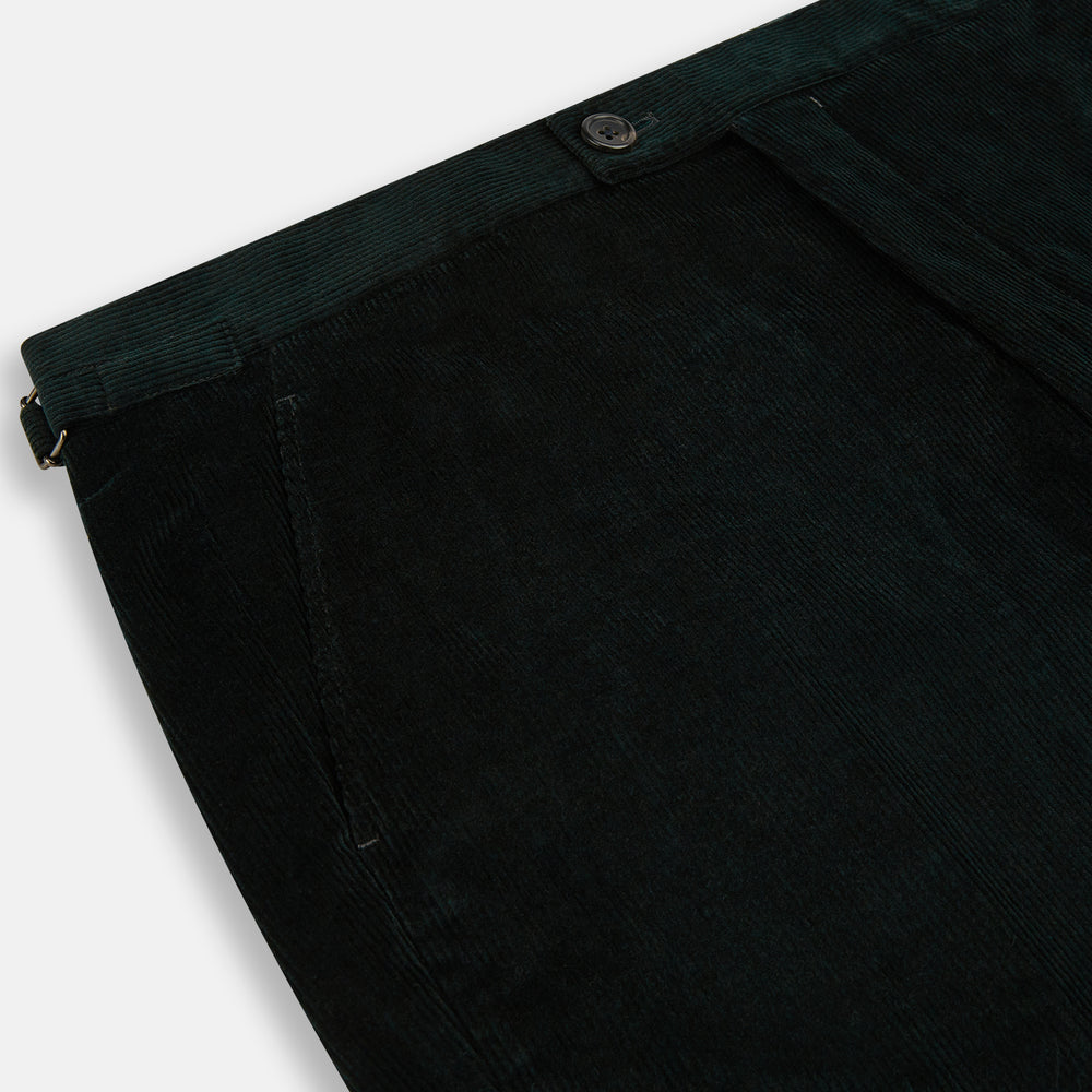 The Dark Green Corduroy Henry Trousers by Turnbull & Asser feature a straight-leg cut, front fly, waistband with belt loops, and button closure—perfect for sophisticated formal looks.