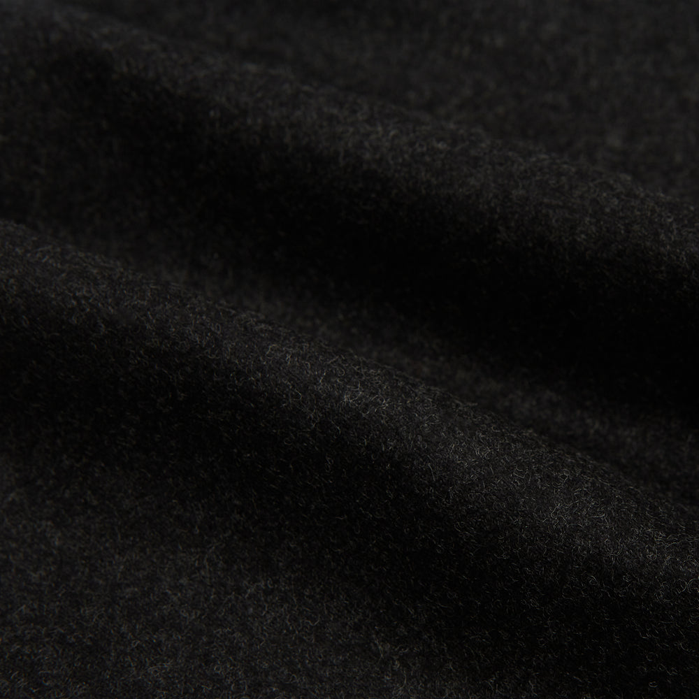 Turnbull & Asser’s Charcoal Henry Trousers, crafted from a wool-cashmere blend with button and zip closure, belt loops, and side pockets, are shown laid flat on a white background.