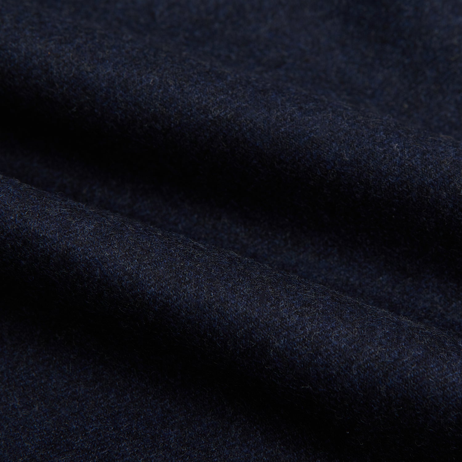 View 6 of product Turnbull & Asser’s Dark Blue Henry Trousers in a wool-cashmere blend feature a button closure, front pleats, and side pockets, shown laid flat on a white background.