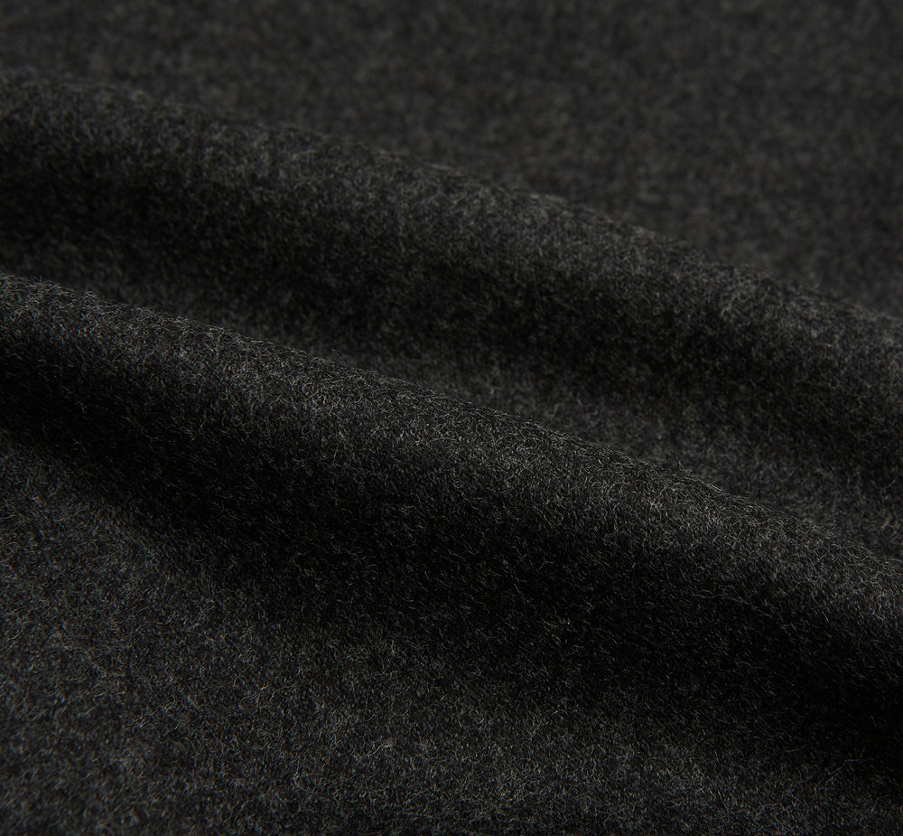 Turnbull & Asser's Dark Grey Henry Trousers are tailored, straight-leg trousers in a luxurious wool-cashmere blend with button and zip closure, belt loops, and front pleats, shown against a white background.