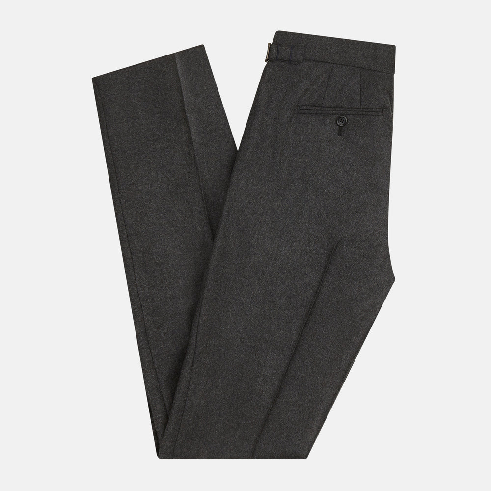 Turnbull & Asser's Dark Grey Henry Trousers are tailored, straight-leg trousers in a luxurious wool-cashmere blend with button and zip closure, belt loops, and front pleats, shown against a white background.