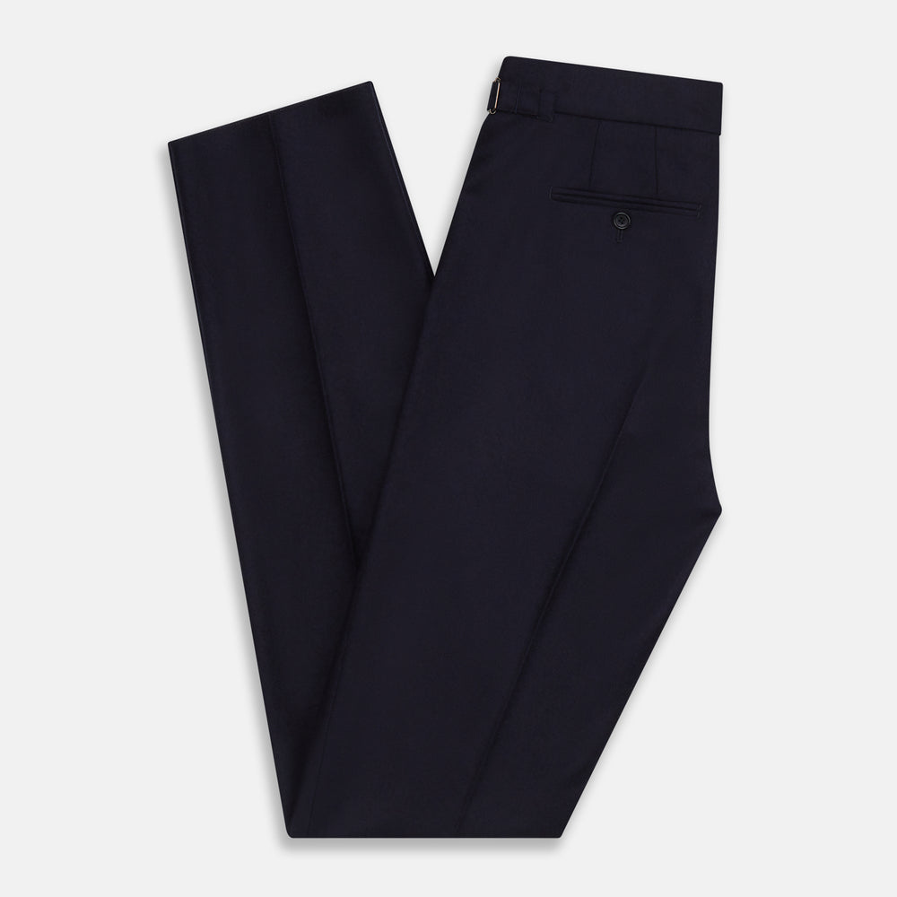 The Turnbull & Asser Midnight Blue Henry Trousers feature a tailored fit, button closure, belt loops, and front pleats in a luxurious wool-cashmere blend, shown against a plain white background.