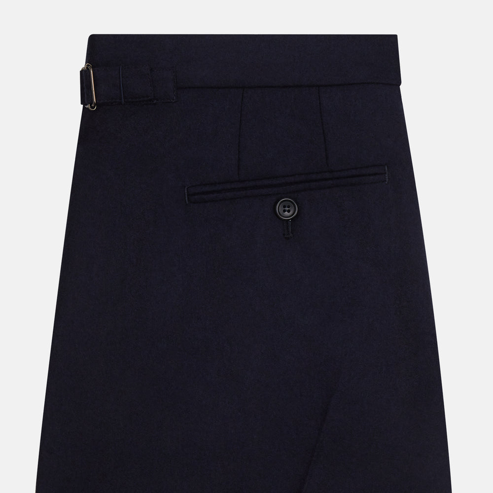 The Turnbull & Asser Midnight Blue Henry Trousers feature a tailored fit, button closure, belt loops, and front pleats in a luxurious wool-cashmere blend, shown against a plain white background.