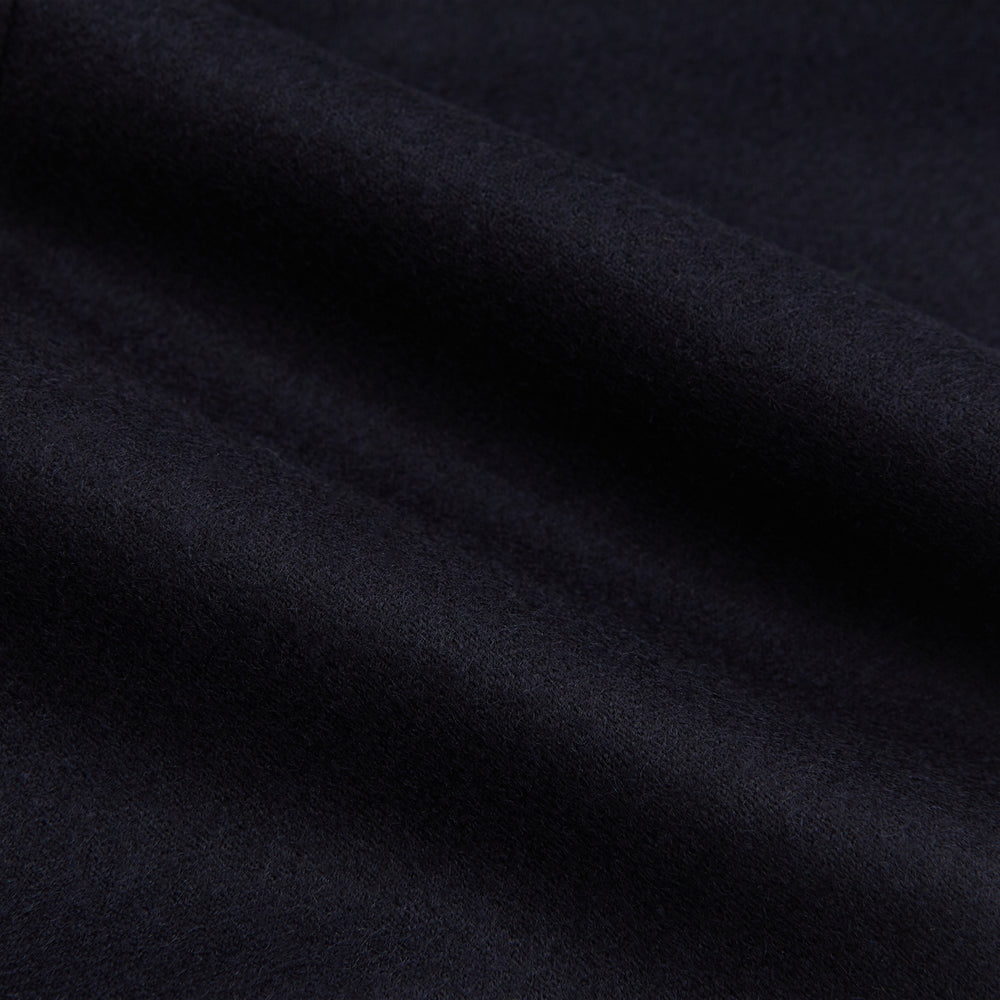 The Turnbull & Asser Midnight Blue Henry Trousers feature a tailored fit, button closure, belt loops, and front pleats in a luxurious wool-cashmere blend, shown against a plain white background.