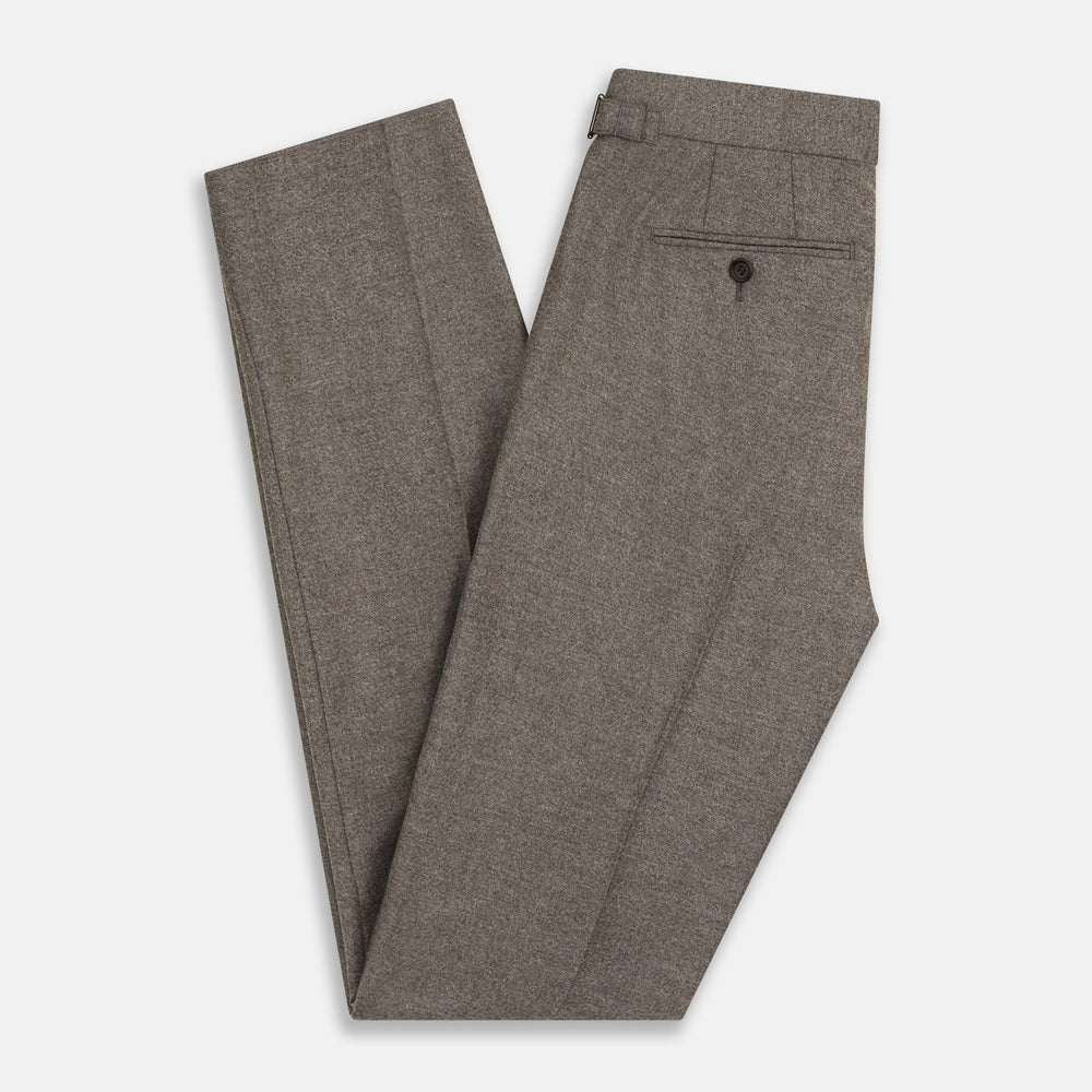 The Stone Henry Trousers by Turnbull & Asser, in a wool-cashmere blend, feature pleats, a button closure, belt loops, and straight legs, shown laid flat on a white background.