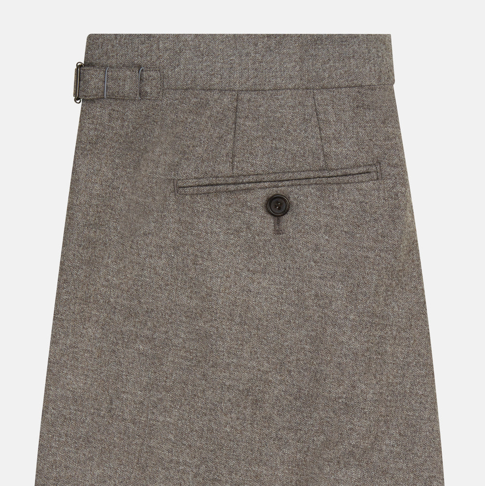 The Stone Henry Trousers by Turnbull & Asser, in a wool-cashmere blend, feature pleats, a button closure, belt loops, and straight legs, shown laid flat on a white background.