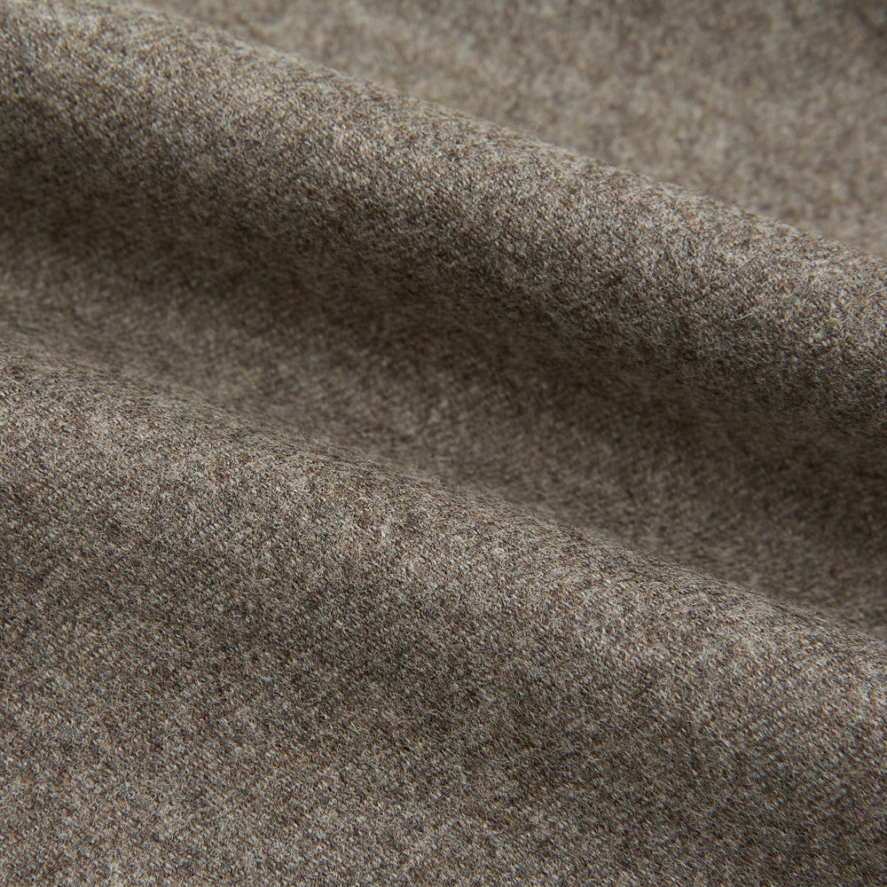 The Stone Henry Trousers by Turnbull & Asser, in a wool-cashmere blend, feature pleats, a button closure, belt loops, and straight legs, shown laid flat on a white background.