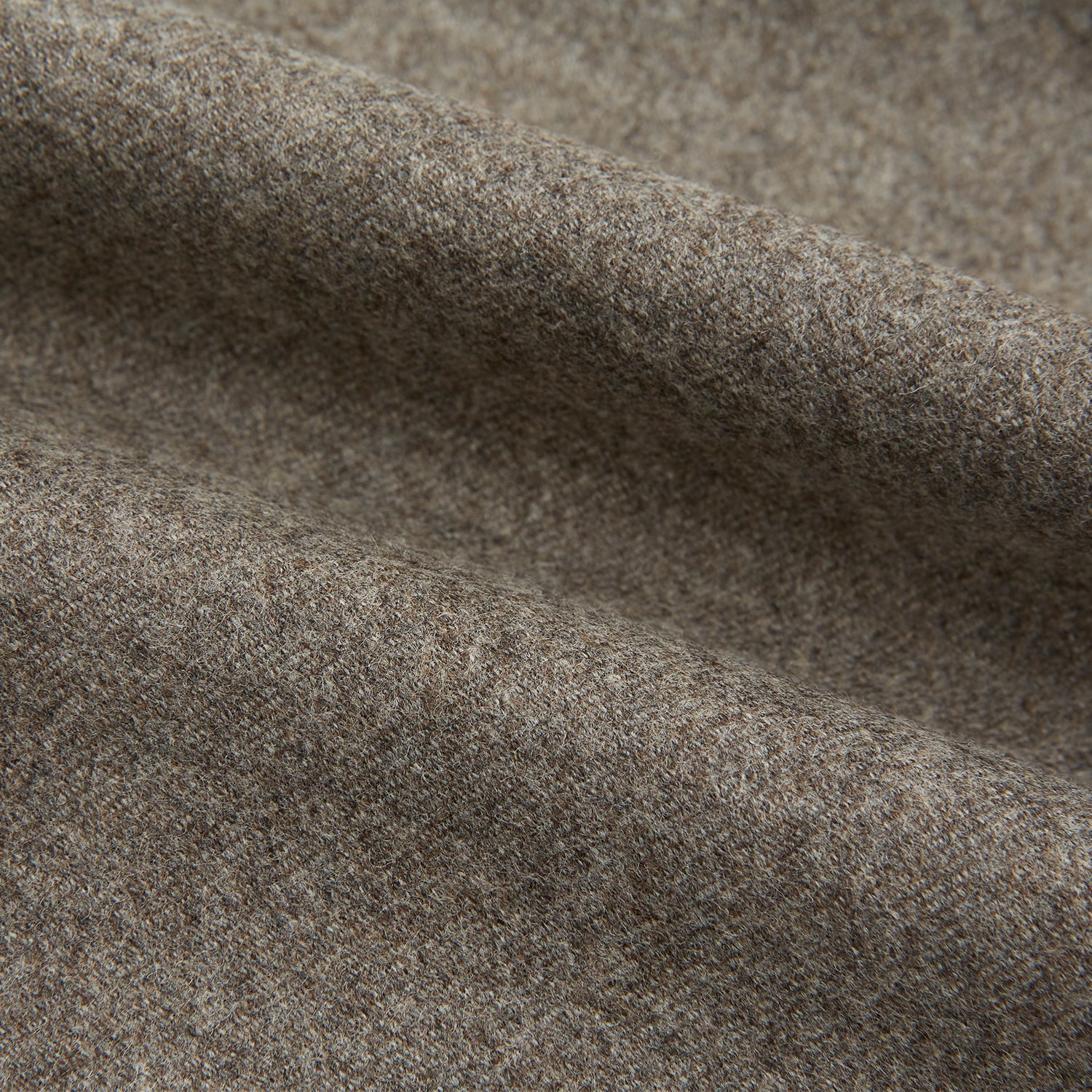 View 6 of product The Stone Henry Trousers by Turnbull & Asser, in a wool-cashmere blend, feature pleats, a button closure, belt loops, and straight legs, shown laid flat on a white background.