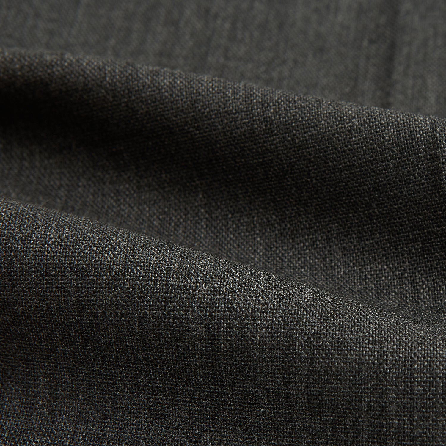 View 6 of product The Turnbull & Asser Charcoal Rupert Trousers, crafted from wool and cashmere with belt loops, button closure, and a slim tailored fit, are shown against a plain white background.