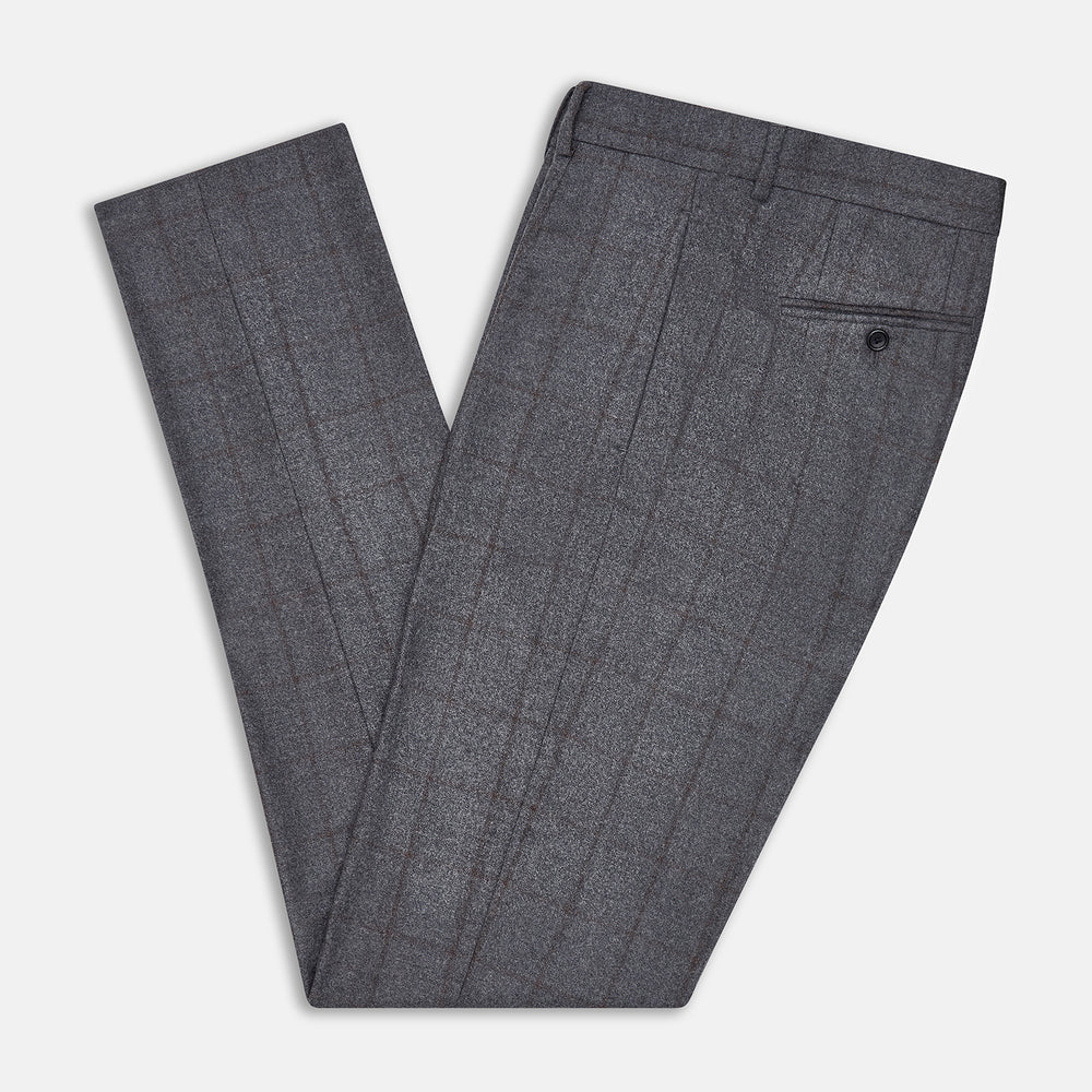 Turnbull & Asser's Grey and Brown Check Rupert Trousers, crafted from a luxurious wool-cashmere blend with front button and zip closure, belt loops, and straight legs, are displayed against a plain white background.