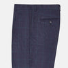 View 4 of product Turnbull & Asser’s Midnight and Green Check Rupert Trousers feature front pleats, belt loops, a button closure, and are finely crafted from wool and cashmere, shown against a plain white background.