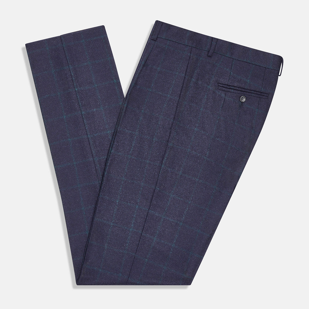 Turnbull & Asser’s Midnight and Green Check Rupert Trousers feature front pleats, belt loops, a button closure, and are finely crafted from wool and cashmere, shown against a plain white background.
