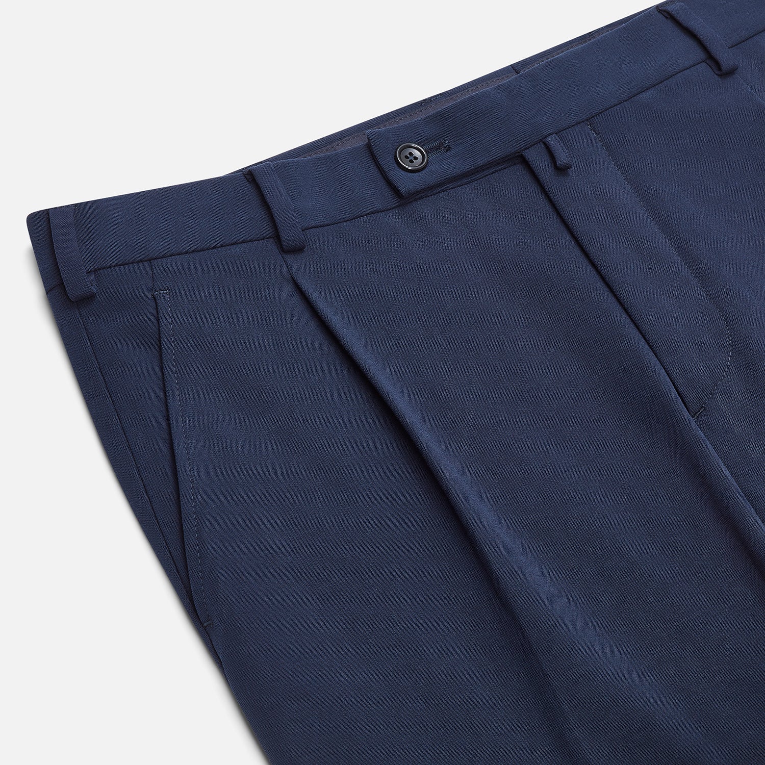 View 2 of product Turnbull & Asser Navy George Trousers in a cotton blend with a single pleat, button and zipper closure, belt loops, and crease detailing down each leg, shown on a plain white background.