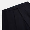 View 2 of product Turnbull & Asser UK Edward Navy Pleated Trousers in Wool Gabardine featuring a navy blue, tailored silhouette with a straight-leg cut and pleated detailing.