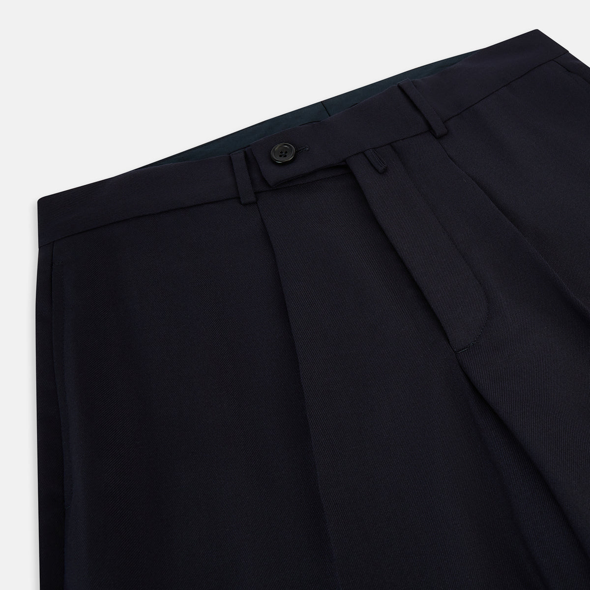 View 2 of product Turnbull & Asser UK Edward Navy Pleated Trousers in Wool Gabardine featuring a navy blue, tailored silhouette with a straight-leg cut and pleated detailing.