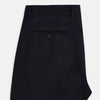 View 5 of product Turnbull & Asser UK Edward Navy Pleated Trousers in Wool Gabardine featuring a navy blue, tailored silhouette with a straight-leg cut and pleated detailing.