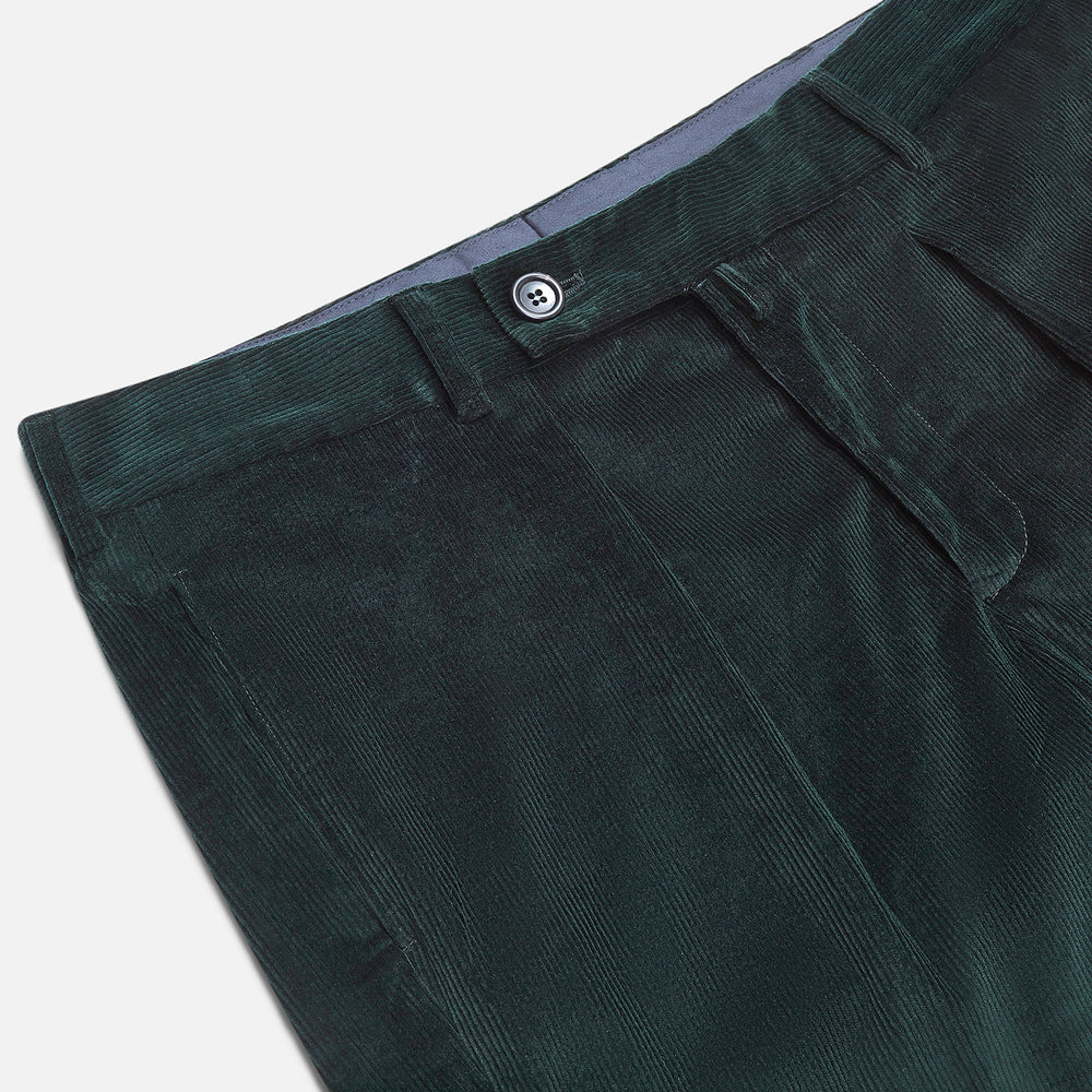Turnbull & Asser Dark Green Corduroy Edward Trousers feature a button and zip closure, front pleats, and straight legs for gentlemen, shown on a plain white background.