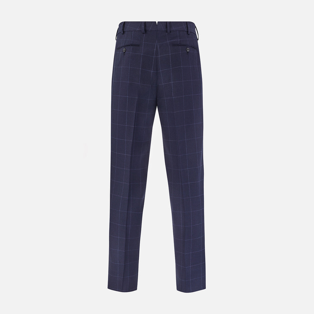 Turnbull & Asser Navy Check Edward Trousers feature a subtle white windowpane pattern, pleated front, belt loops, and button closure, shown against a plain white background.