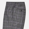 View 4 of product Turnbull & Asser's Grey Check Edward Trousers feature a tailored fit, front pleats, waistband with belt loops, and button closure—crafted from a wool-cotton blend. Ideal for semi-formal wear. Shown on a plain white background.